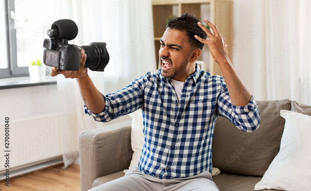 blogging, videoblog and people concept - angry indian male video blogger  with camera videoblogging at home Stock-Foto | Adobe Stock