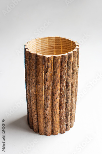 Handmade wooden cup container on white wooden background