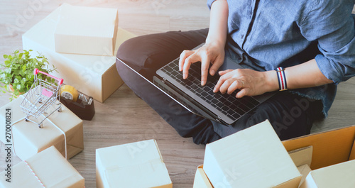 Shipping online ,young woman start up small business owner in Labtop at workplace.small business entrepreneur SME or freelance