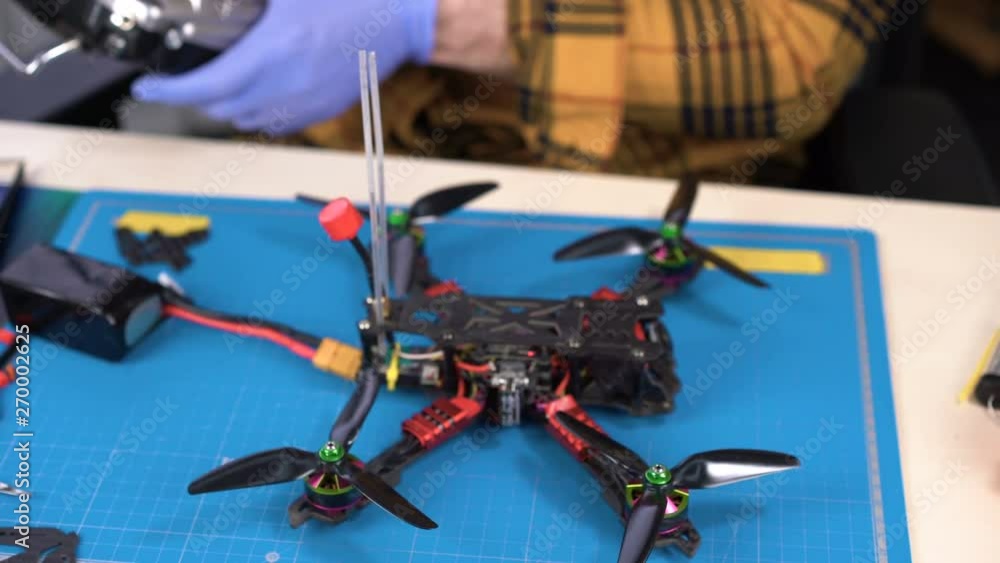 Testing drone launch at repair desk, radio controller, drone building, modelling Testing drone launch at repair desk, radio controller, drone building, modelling