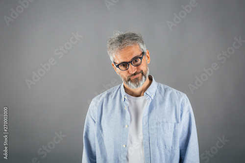 thoughtful man isolated on gray background