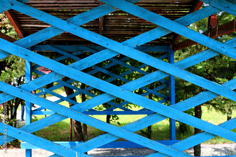 Old wooden lattice on nature background. Wooden trellis Old wooden lattice on nature background. Wooden trellis
