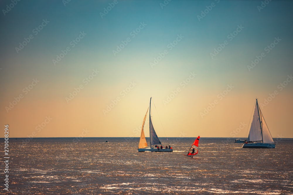 Fototapeta premium Sailing ship yacht with white sails in the sea