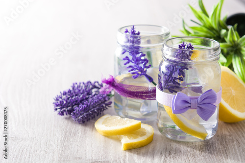 Lavender lemonade drink in jar on wooden table