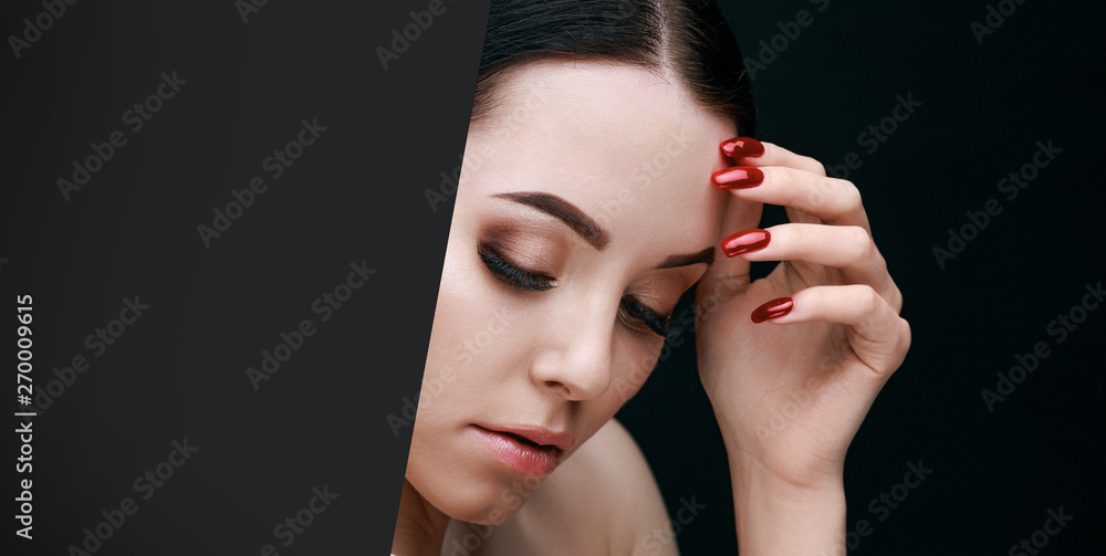 Portrait of brunette model with natural evening make up with bare shoulders in the hole of dark paper. Beautiful young woman with long eyelashes, trendy eyebrows and perfect glow skin. Portrait of brunette model with natural evening make up with bare shoulders in the hole of dark paper. Beautiful young woman with long eyelashes, trendy eyebrows and perfect glow skin.
