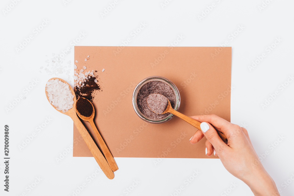 Making homemade scrub of ground coffee and sea salt Making homemade scrub of ground coffee and sea salt
