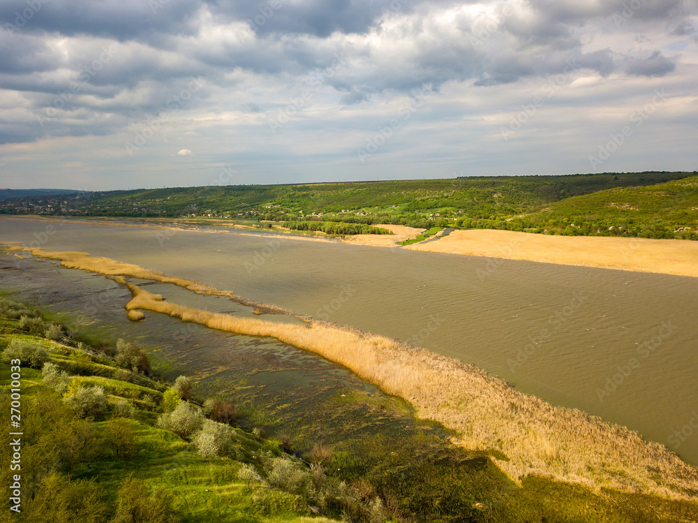 Flight over the river and forest at spring time. Dniester river of Moldova republic. Flight over the river and forest at spring time. Dniester river of Moldova republic.