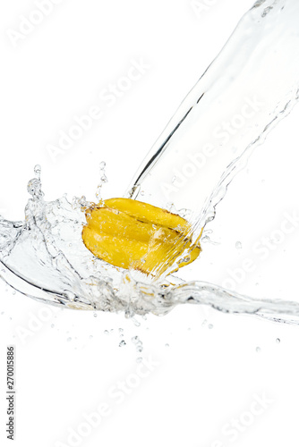 whole ripe star fruit and water splash with drops isolated on white © LIGHTFIELD STUDIOS