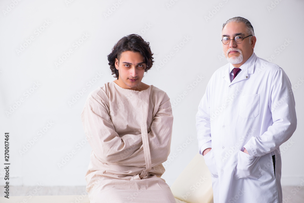 Aged male doctor psychiatrist examining young patient 
