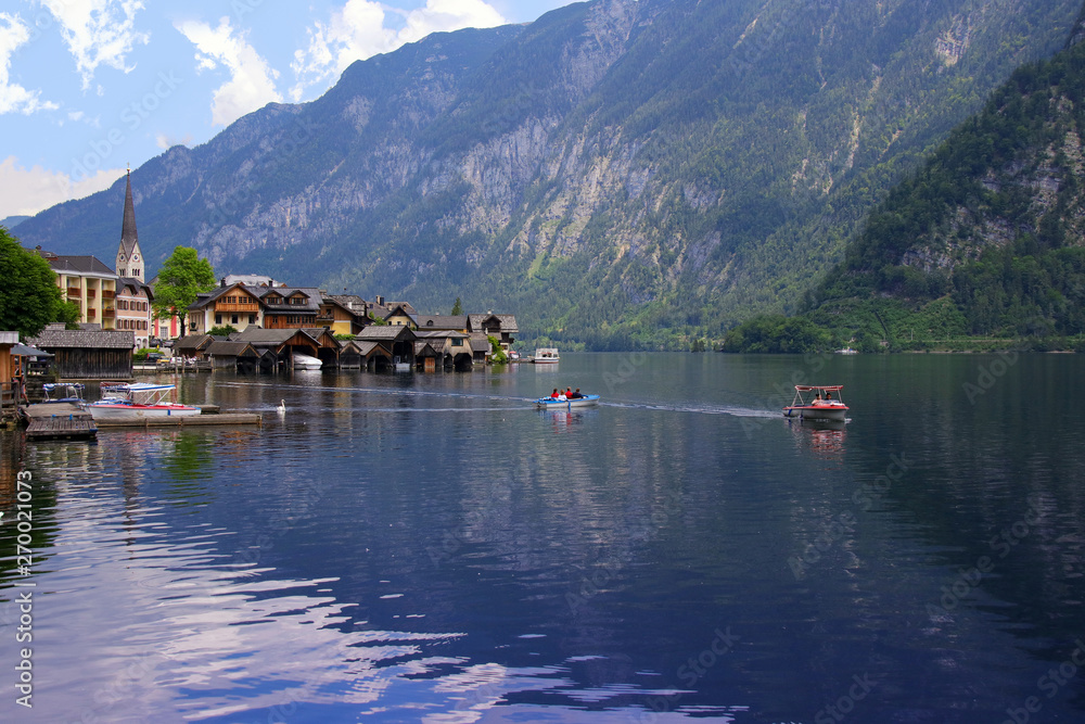 View to the holiday destination Hallstatt, Boating on lake, Salzkammergut - Austria