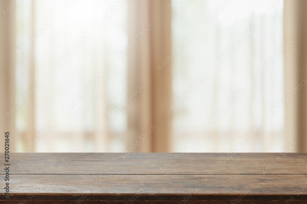 Empty wood table top and blurred home interior with curtain window background with vintage filter - can used for display or montage your products. Empty wood table top and blurred home interior with curtain window background with vintage filter - can used for display or montage your products.