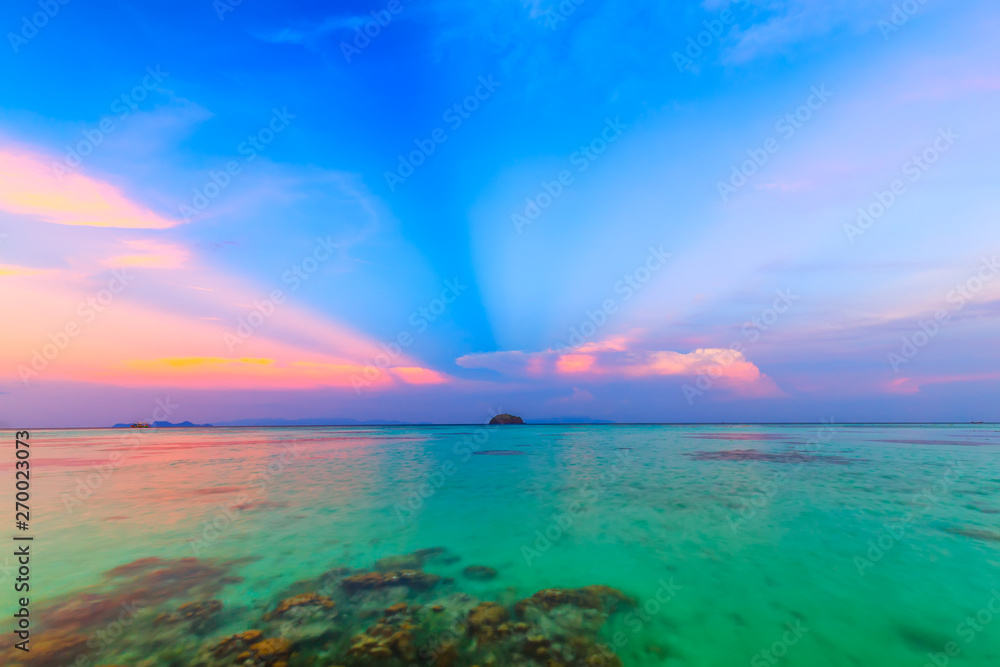 Beautiful sunset on white sand beach and Clear water to see the coral reef at Koh Lipe island in Satun,Thailand
