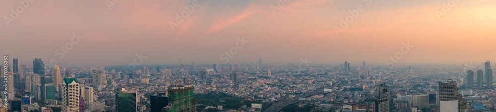 Obraz premium Long horizontal panorama cityscape of Bangkok at sunset. Thailand