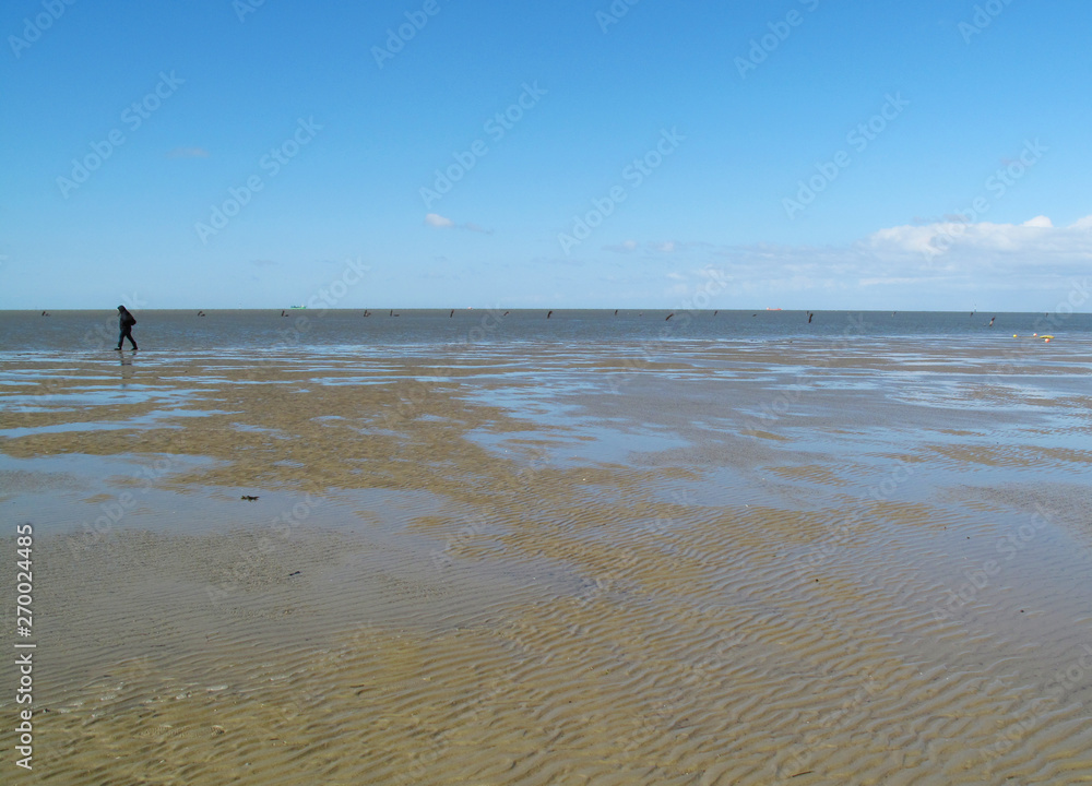 Walking on the north sea shore at low tide