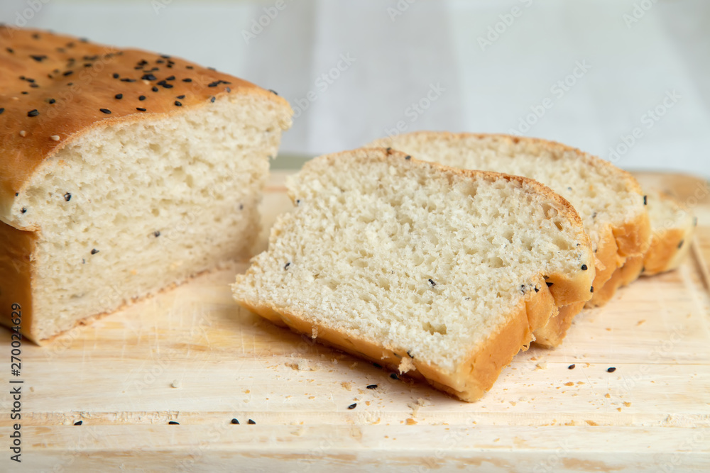 Homemade white bread with sesame. Selective focus, close-up. Homemade white bread with sesame. Selective focus, close-up.