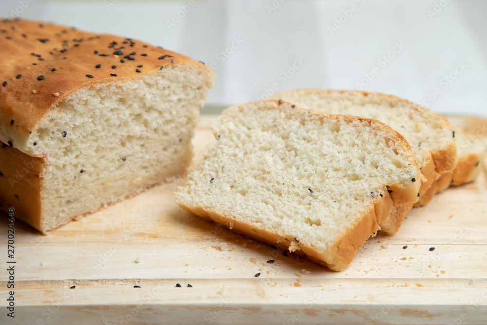 Homemade white bread with sesame. Selective focus, close-up. Homemade white bread with sesame. Selective focus, close-up.