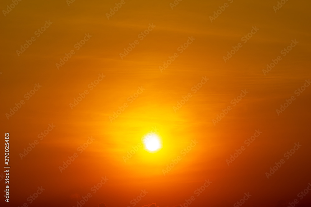 The yellow sun shining on orange sky nature background