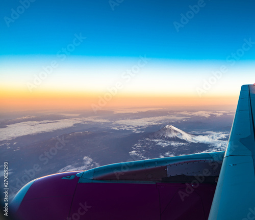 clouds sky skyscape and fuji mountain. Sunrise view from the window of an airplane flying in the clouds, top view clouds like the sea of clouds sky background, Aerial view background, Yamanashi, Japan
