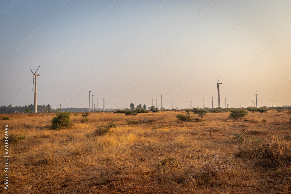 Windmills in farming field Windmills in farming field