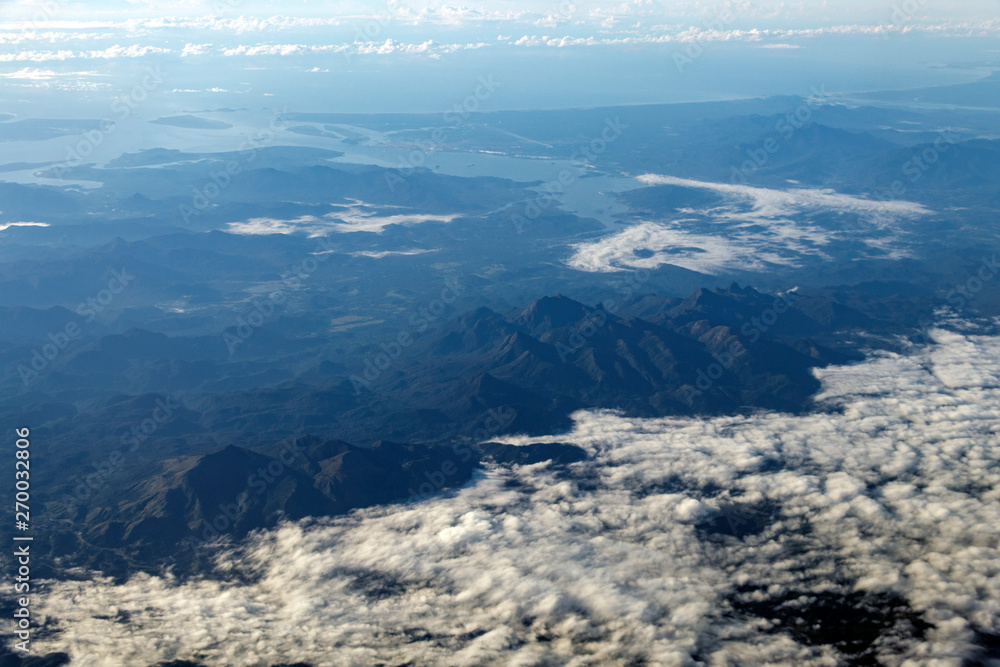 Aerial landscape view from the airplane above American Andes mountain range
