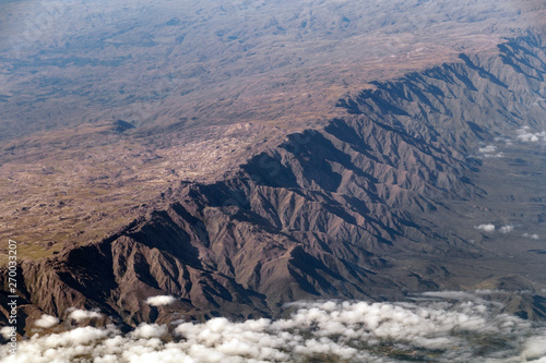 Aerial landscape view from the airplane above American Andes mountain range