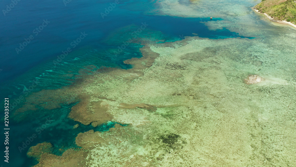 Aerial view lagoon with coral reef, atoll and turquoise water. Busuanga, Palawan, Philippines. Seascape island and clear blue water tropical landscape