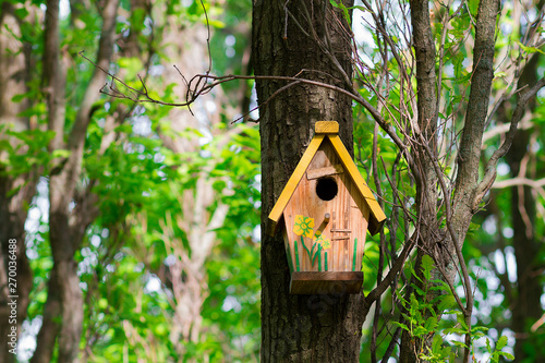 house for the birds. shelter for birds on the tree. nesting box wooden. house for wintering birds