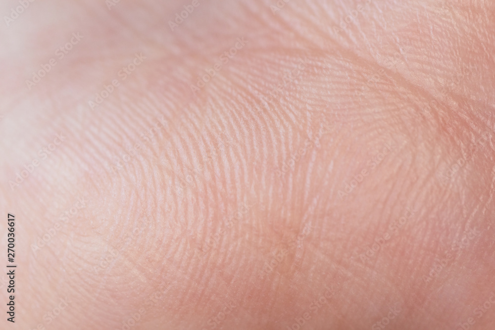 Human skin texture of hand palm, close up background with selective focus