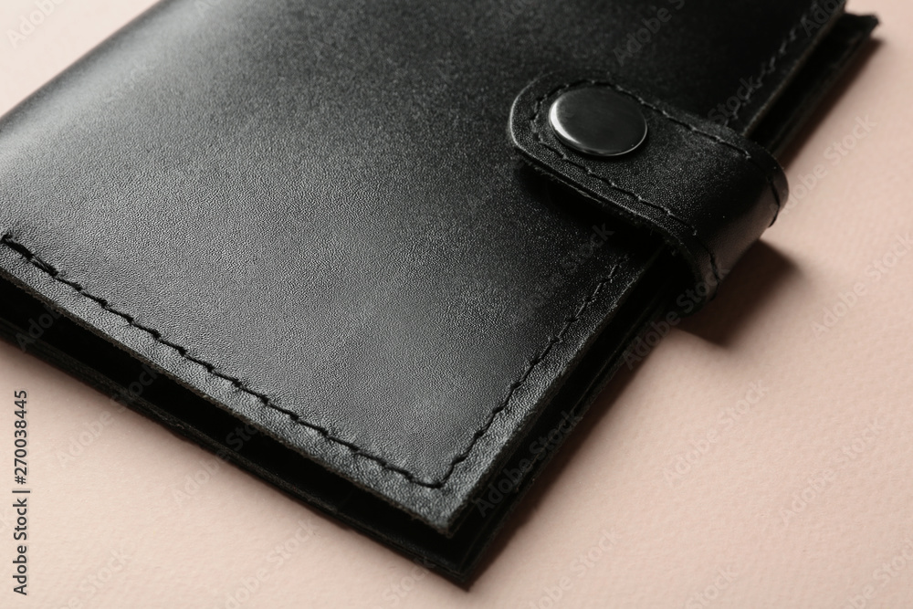 Stylish leather wallet on color background, closeup Stylish leather wallet on color background, closeup