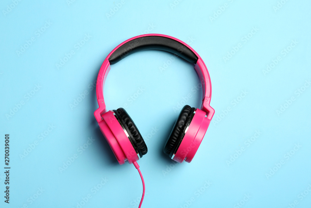 Stylish headphones on color background, top view Stylish headphones on color background, top view