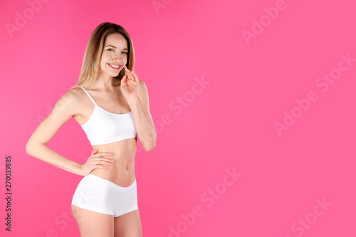 Young slim woman on color background, space for text. Perfect body