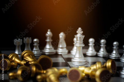 Chess figures on board with black background,business concept