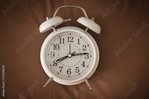 Alarm clock on the bed, Wakes up in the morning , Vintage