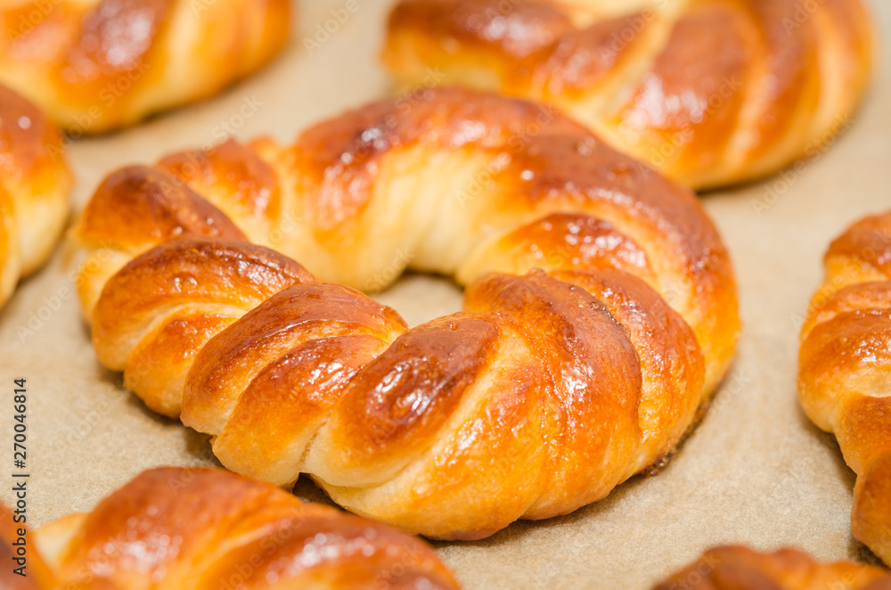 Homemade baked sweet rolls on an oven tray Homemade baked sweet rolls on an oven tray