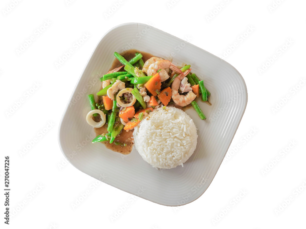 Stir fried mixed vegetables with shrimp,squid and Yard long bean, carrots topped with oyster sauce on dish, isolated white background Stir fried mixed vegetables with shrimp,squid and Yard long bean, carrots topped with oyster sauce on dish, isolated white background