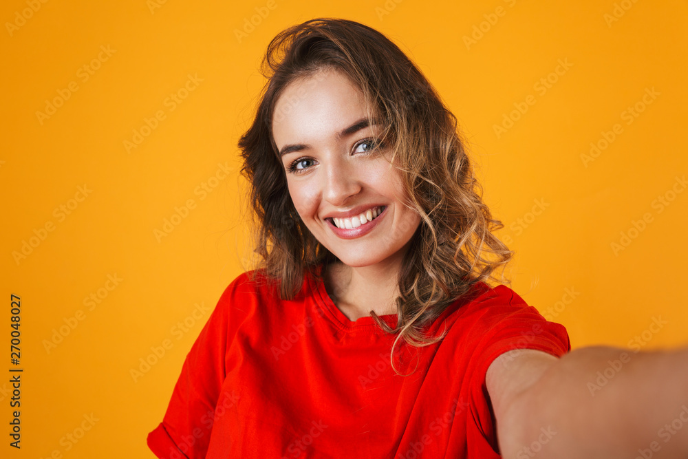 Portrait of a lovely cheerful young woman standing Portrait of a lovely cheerful young woman standing