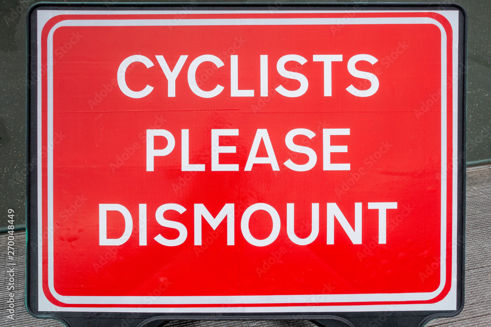 Cyclists please dismount sign Cyclists please dismount sign