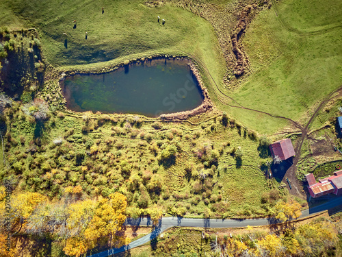 Fototapeta Naklejka Na Ścianę i Meble -  Scenic landscape with farm at autumn in Woodstock, Vermont, USA. Fall in New England. Aerial drone shot.