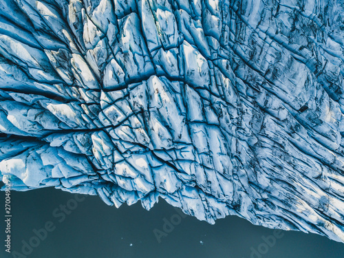 Bild auf Leinwand aerial view of glacier from above, ice texture landscape, beautiful nature blue