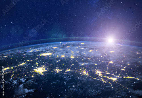 Fototapeta Naklejka Na Ścianę i Meble -  night view of planet Earth from space, beautiful high tech  background with sun and stars, closeup, original image furnished by NASA