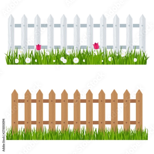 Wooden fence near flower bed