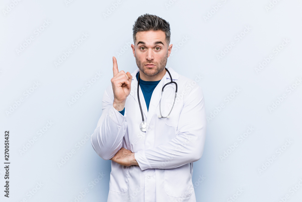 Young handsome doctor man having some great idea, concept of creativity. Young handsome doctor man having some great idea, concept of creativity.