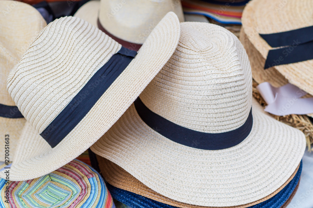 Straw hats for sale, for men of light colors.
