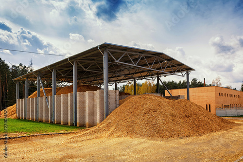 Photography storage for wood chips in the street under a canopy