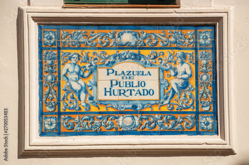 Indicative sign of square name made by colored tiles in Caceres