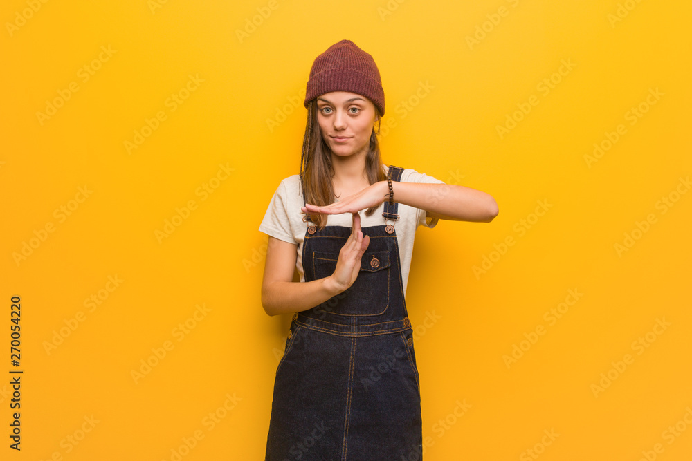 Young hipster woman doing a timeout gesture Young hipster woman doing a timeout gesture