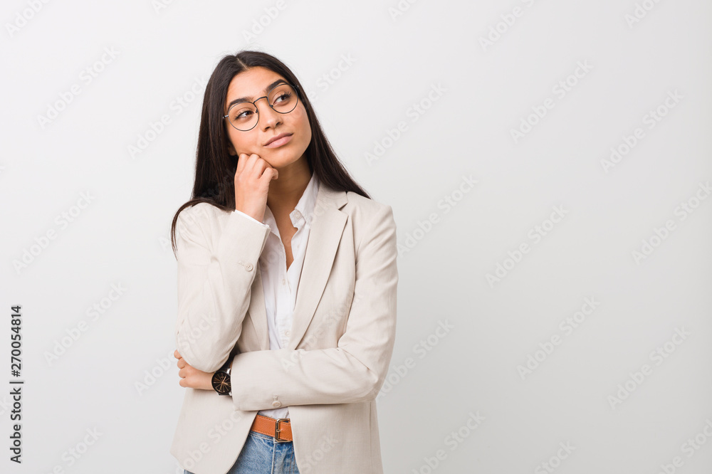 Young business arab woman isolated against a white background who feels sad and pensive, looking at copy space. Young business arab woman isolated against a white background who feels sad and pensive, looking at copy space.