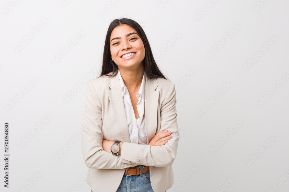 Young business arab woman isolated against a white background laughing and having fun. Young business arab woman isolated against a white background laughing and having fun.