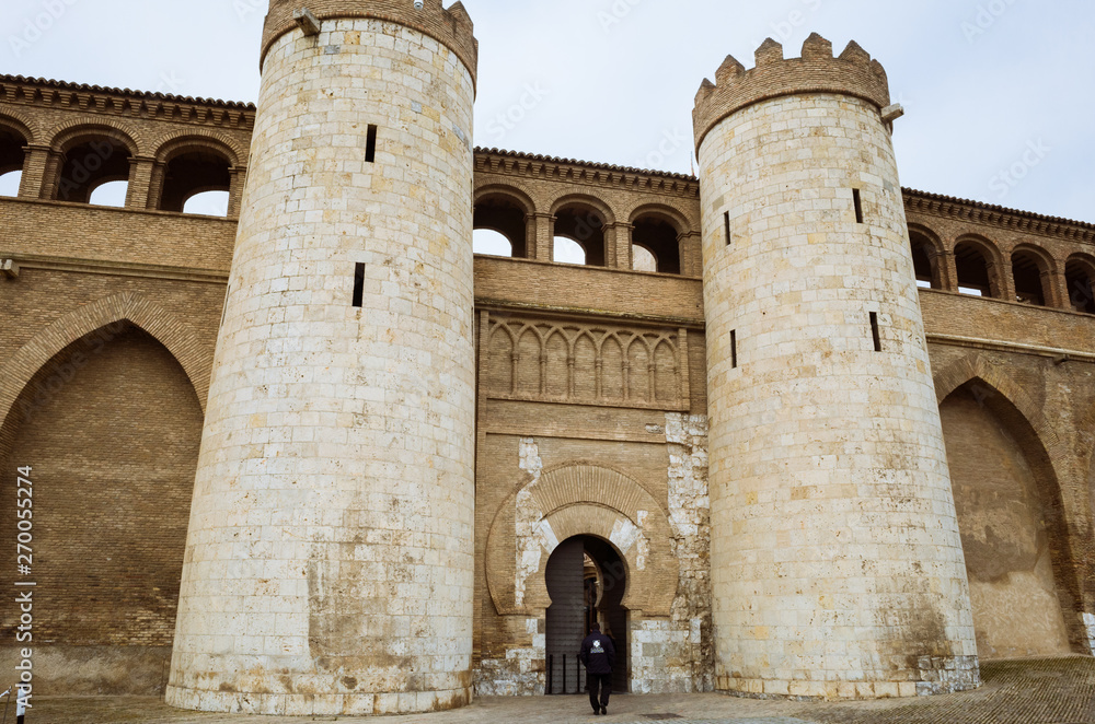 Zaragoza, Aragon, Spain - February 14th, 2019 : Main entrance and walls of the Aljafería Palace Unesco World Heritage Site.