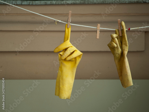 Photos rubber gloves hanging on a clothesline